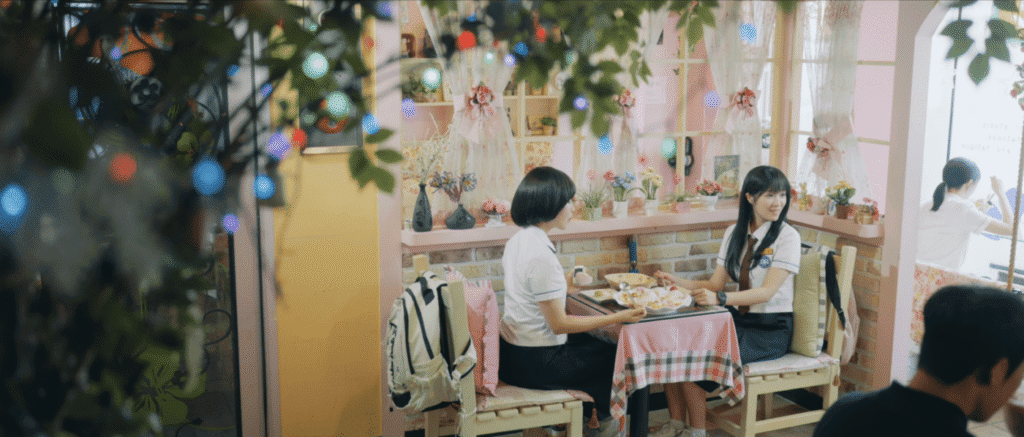 CanMore café interior with hanging flowers and plant décor