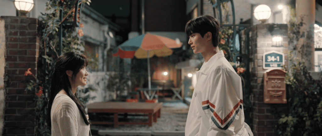 K-drama couple at Mong+ed traditional alley with lanterns