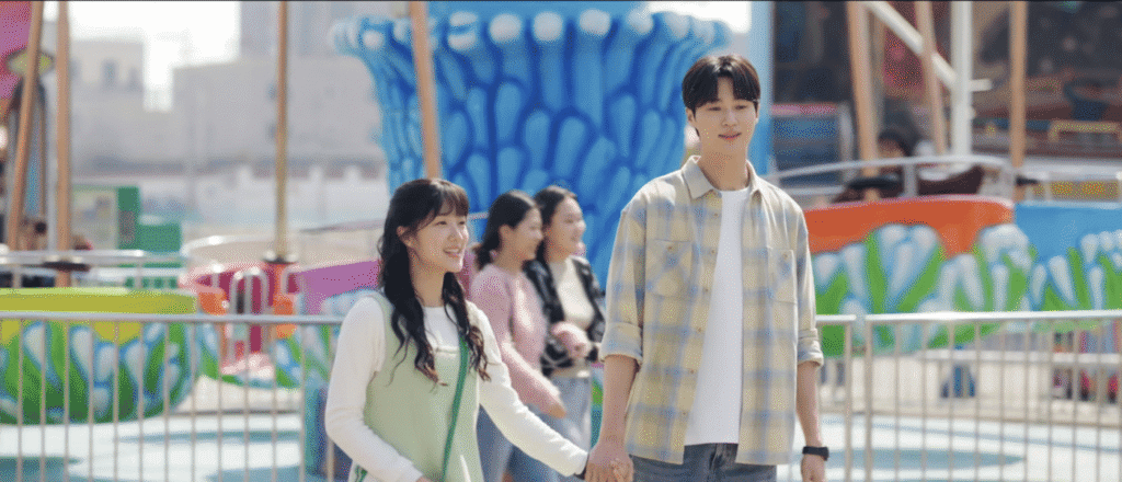 K-drama cast at Sapgyoho Amusement Park with colorful backdrop
